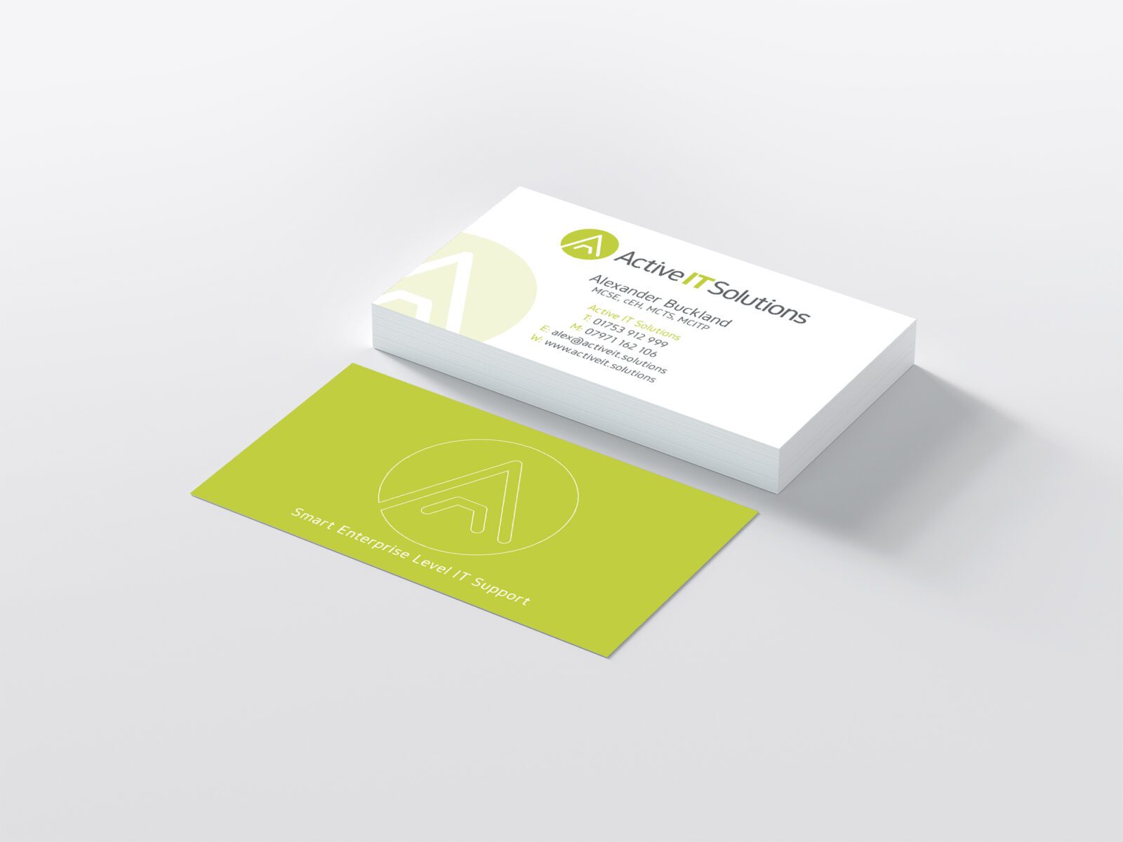 Mock-up of Active IT Solution's brand and business card design.